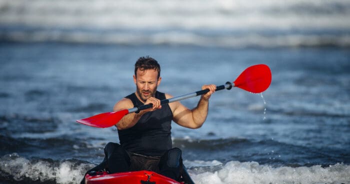 Man Kayaking in the Sea